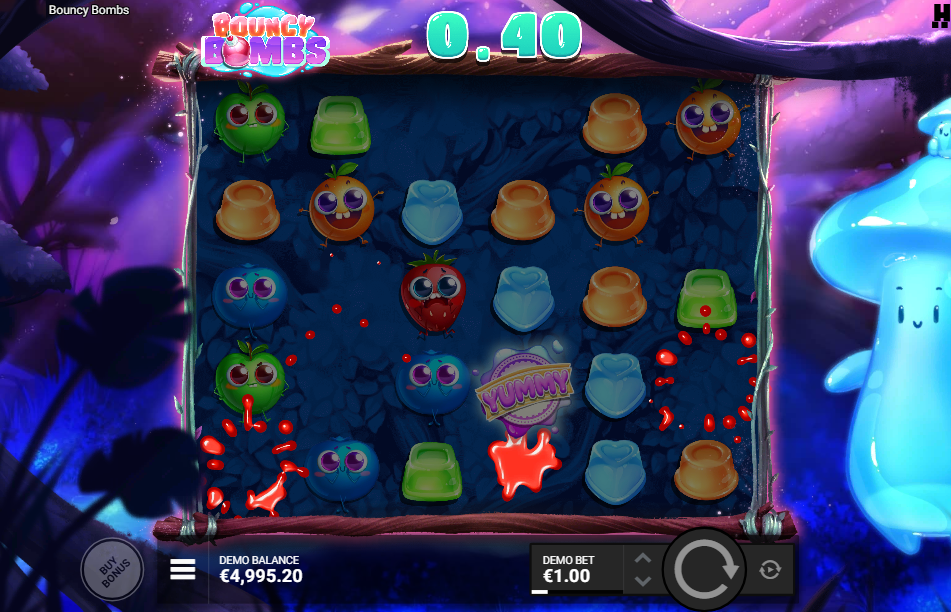 Red jelly symbols bursting mid-cascade on the Bouncy Bombs grid beside a YUMMY scatter, with a 0.40 win shown