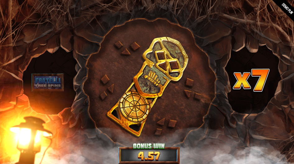 Booby Trap bonus, the skull key mid-turn in the cave beside a x7 multiplier.