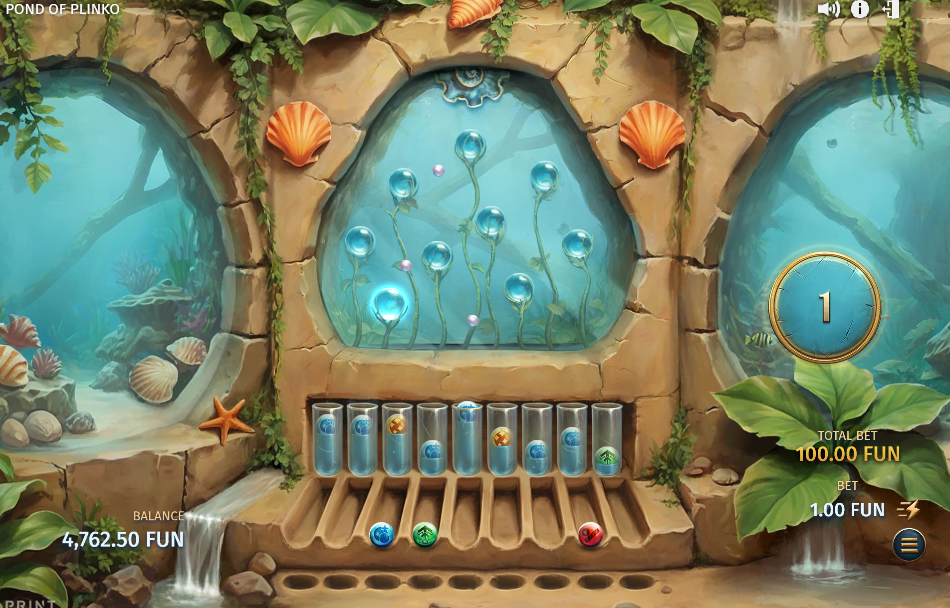 Enhancer Game with one pearl left, nine glass tubes at different fill levels and three collected Enhancers in the trays below