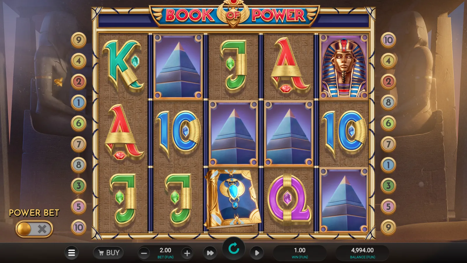 Book of Power reels with four pyramids, a blue Book on reel 3 and the Power Bet switch off