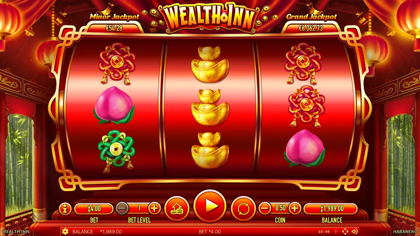 Wealth Inn reels with three gold ingots stacked on the middle reel beside peaches and red knots